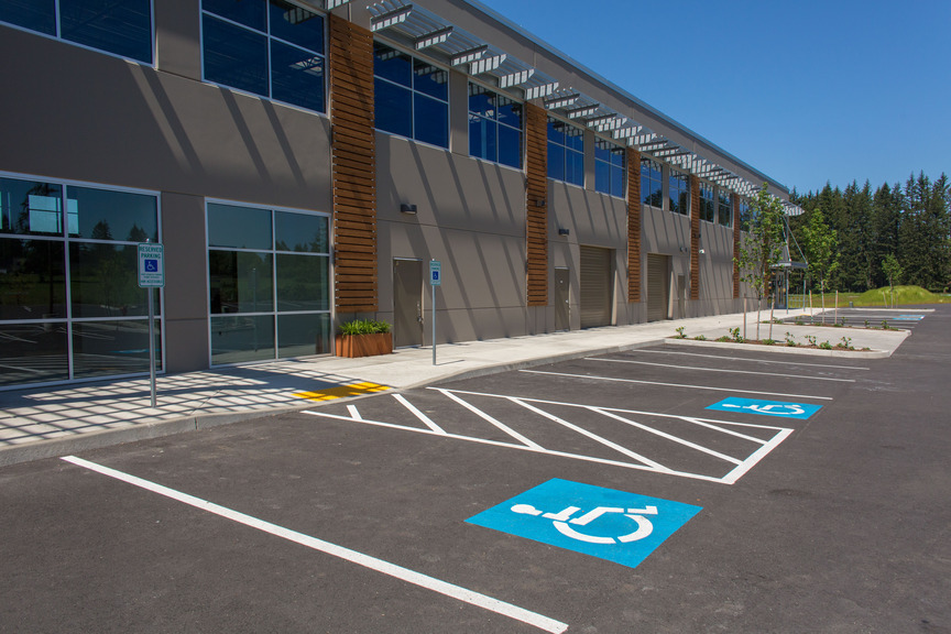 Photo of an Industrial building with parking lot and 2 ADA parking spaces