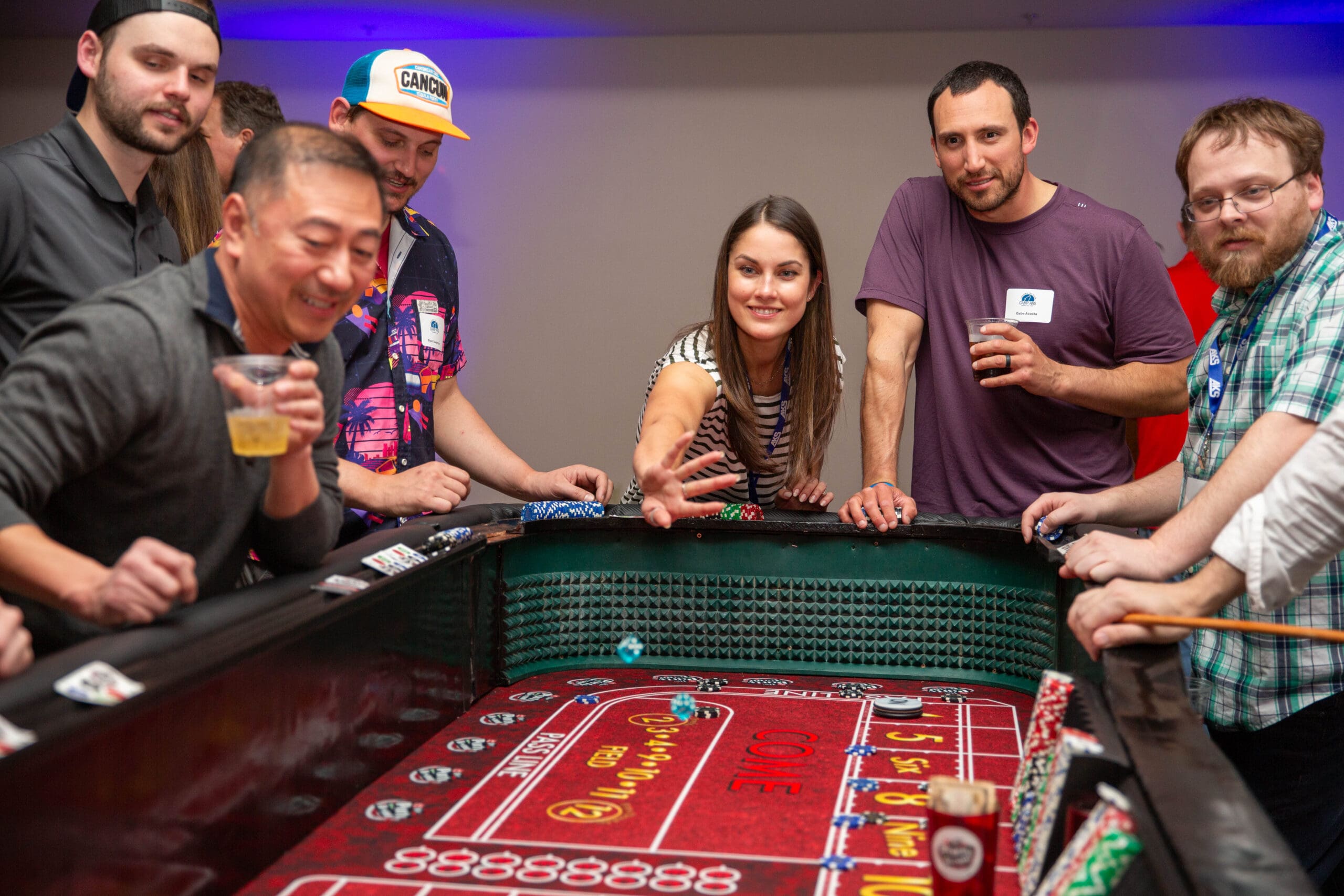 Employees enjoy a casino night team-building activity during Camp AKS 2025, the company’s annual retreat held in Redmond, Oregon.