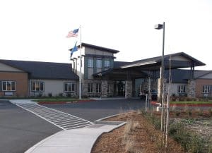 memory care facility, entrance, sidewalk, landscape, entrance