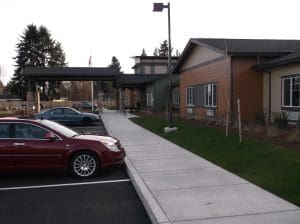 memory care facility, entrance, sidewalk, landscape